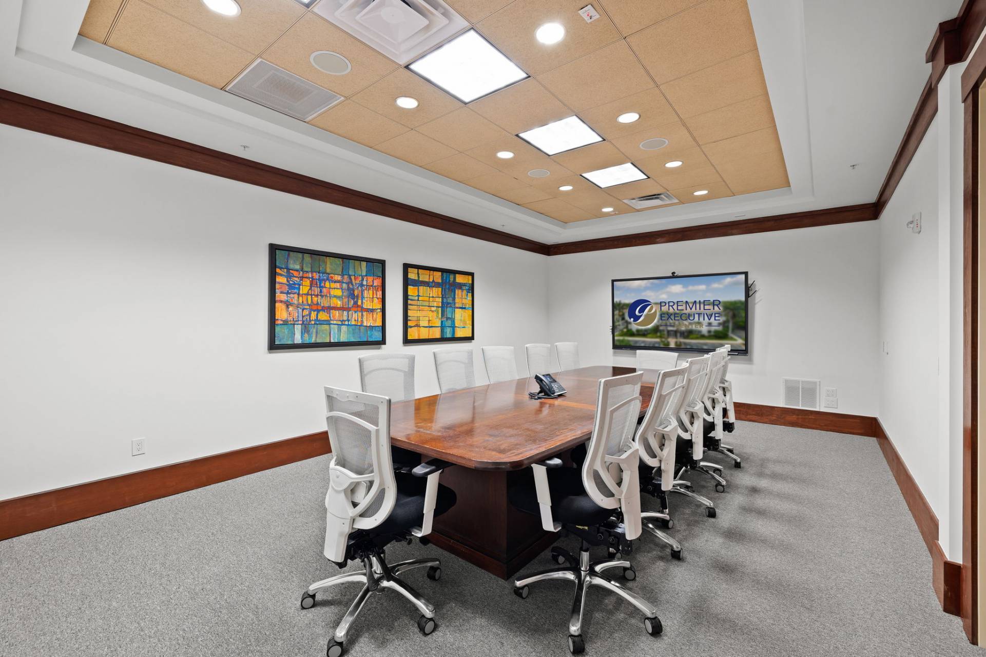 Conference room rental with 86” smartboard, VOIP phone, and seating for up to 20 – perfect for business meetings.