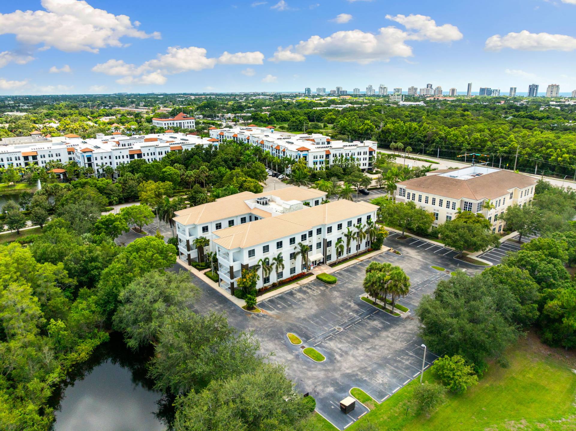 Fort Myers FL show office with modern furniture, lush plants, and natural lighting in a professional workspace setting.