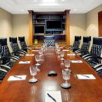 Our highly professional primary conference room features a table seating twelve and room for an additional twelve conference participants