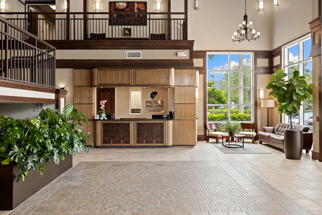 Fort Myers business center lobby showing reception desk, waiting area, and welcoming office environment.