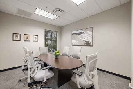 Private meeting room in Naples FL with seating for 6, VOIP phone, Wi-Fi, and individual temperature control.